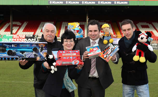 Michael Magee, Connswater Community Centre (left); Myrtle Neill, Carew II Family and Training Centre and Damien Brennan, Short Strand Community Centre (right) showcase some of their toys alongside Russell Lever, Community Relations Officer at Glentoran (centre) following the success of the inaugural Glentoran 2011 Christmas Toy Appeal